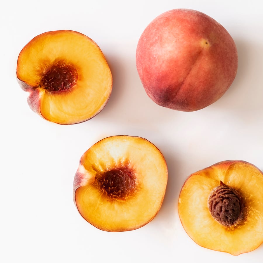 Bougie parfumée dans verre, pêche orange clair